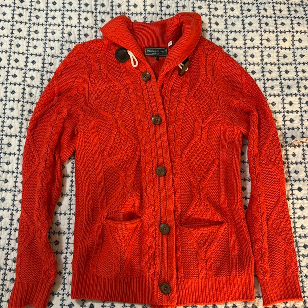 Paisley & Gray knit sweater with wood-like buttons, orange. 5 buttons, 1 toggle.